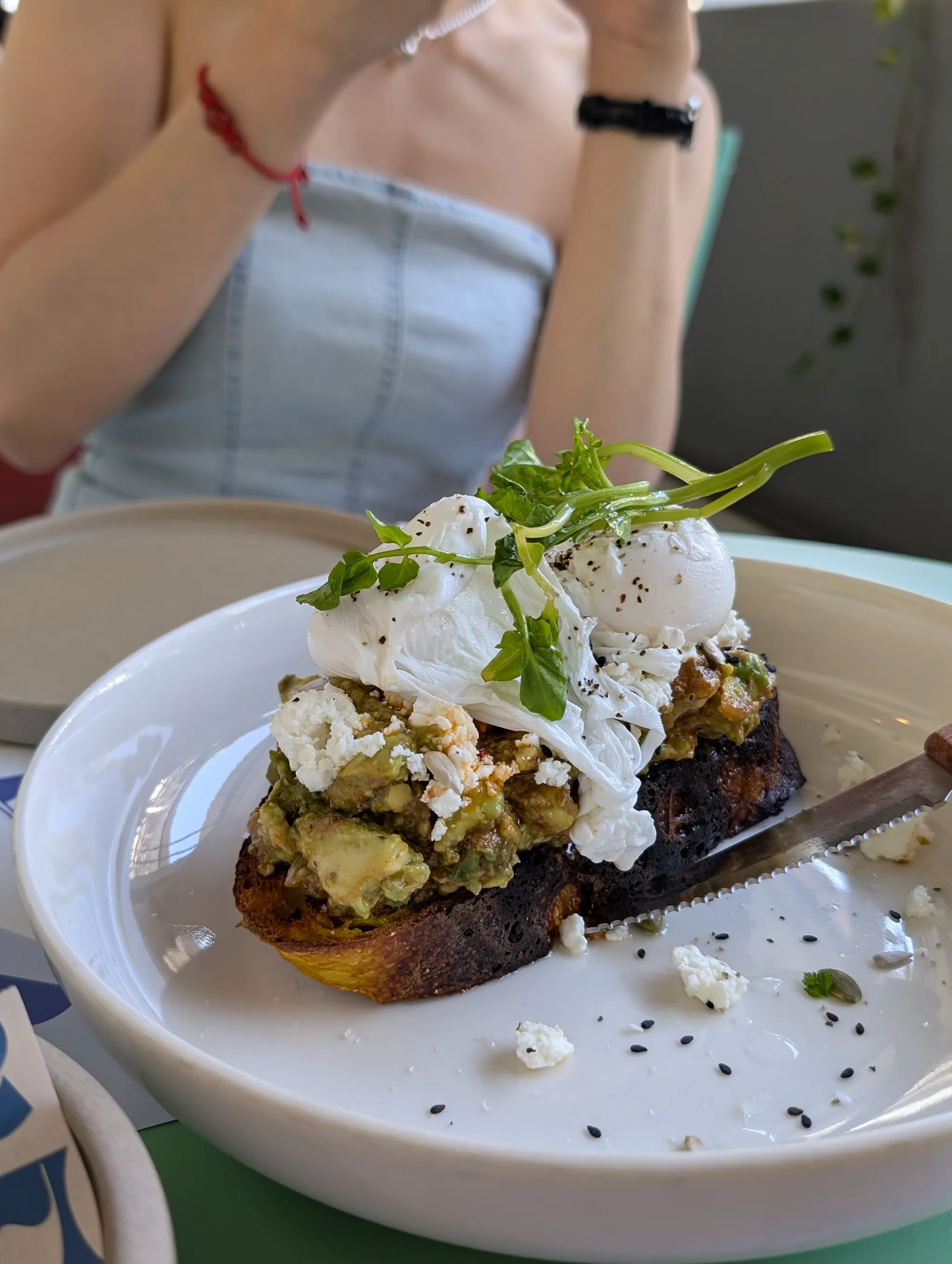 Avocado on Toast with Burnt Sherry Tomato Vinaigrette, Feta Cheese, Poached Eggs & Seeds from Alani, Singapore