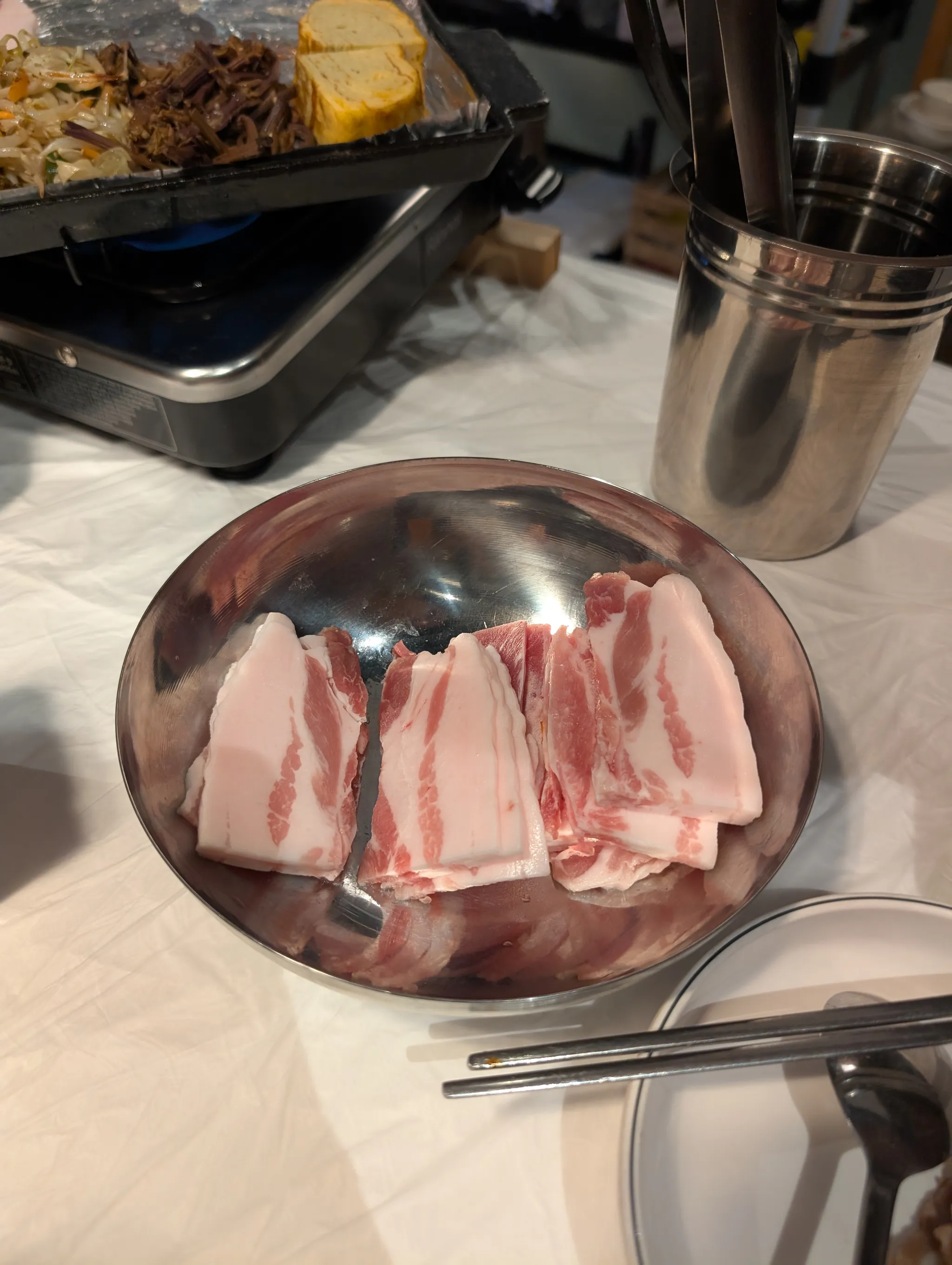 Flash-frozen 3mm Jeju pork belly slices at Bae Sik Dang Singapore