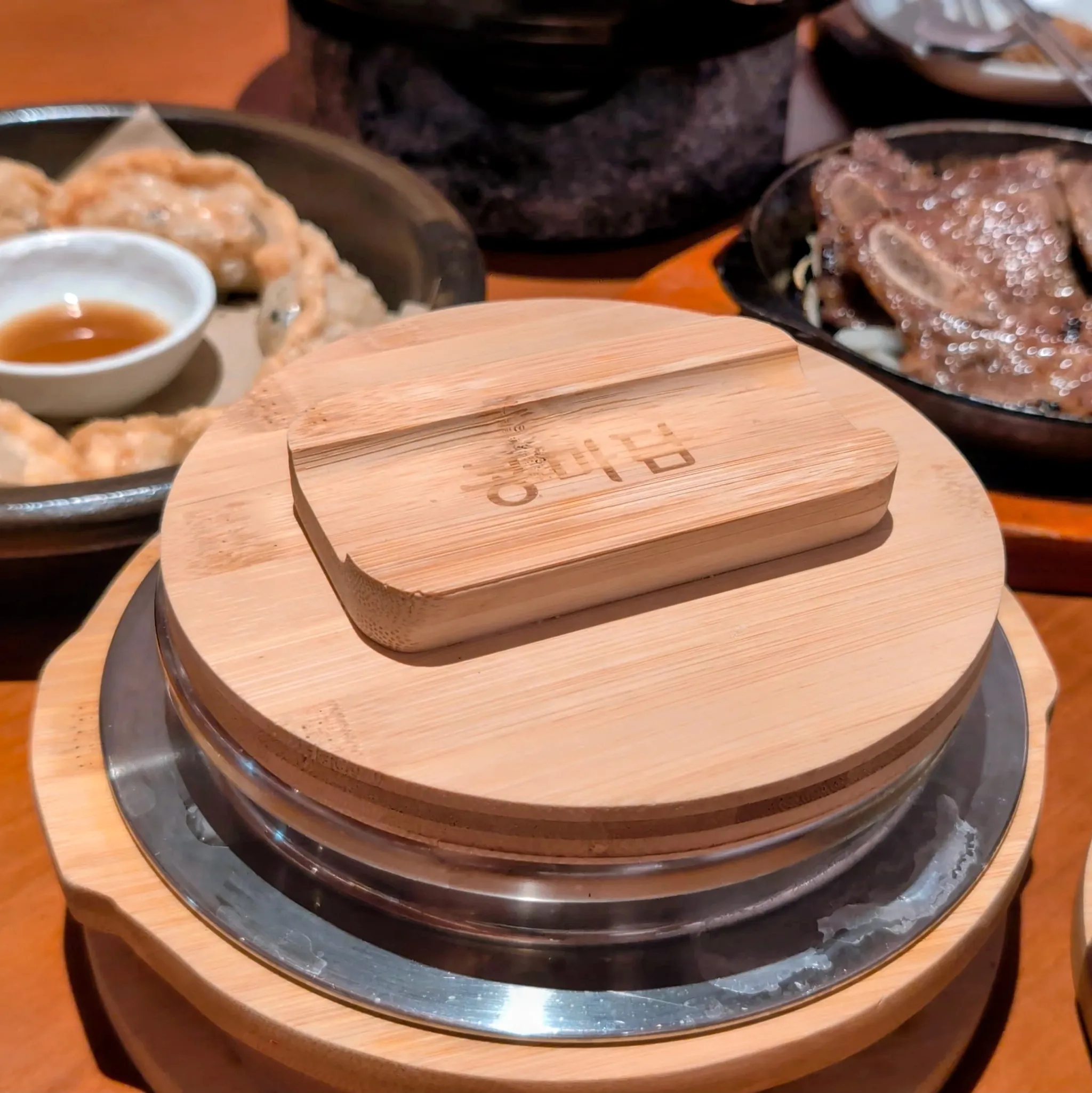 A covered bowl of Hot Stone Rice from Kong Madam, Guoco Midtown II, Singapore