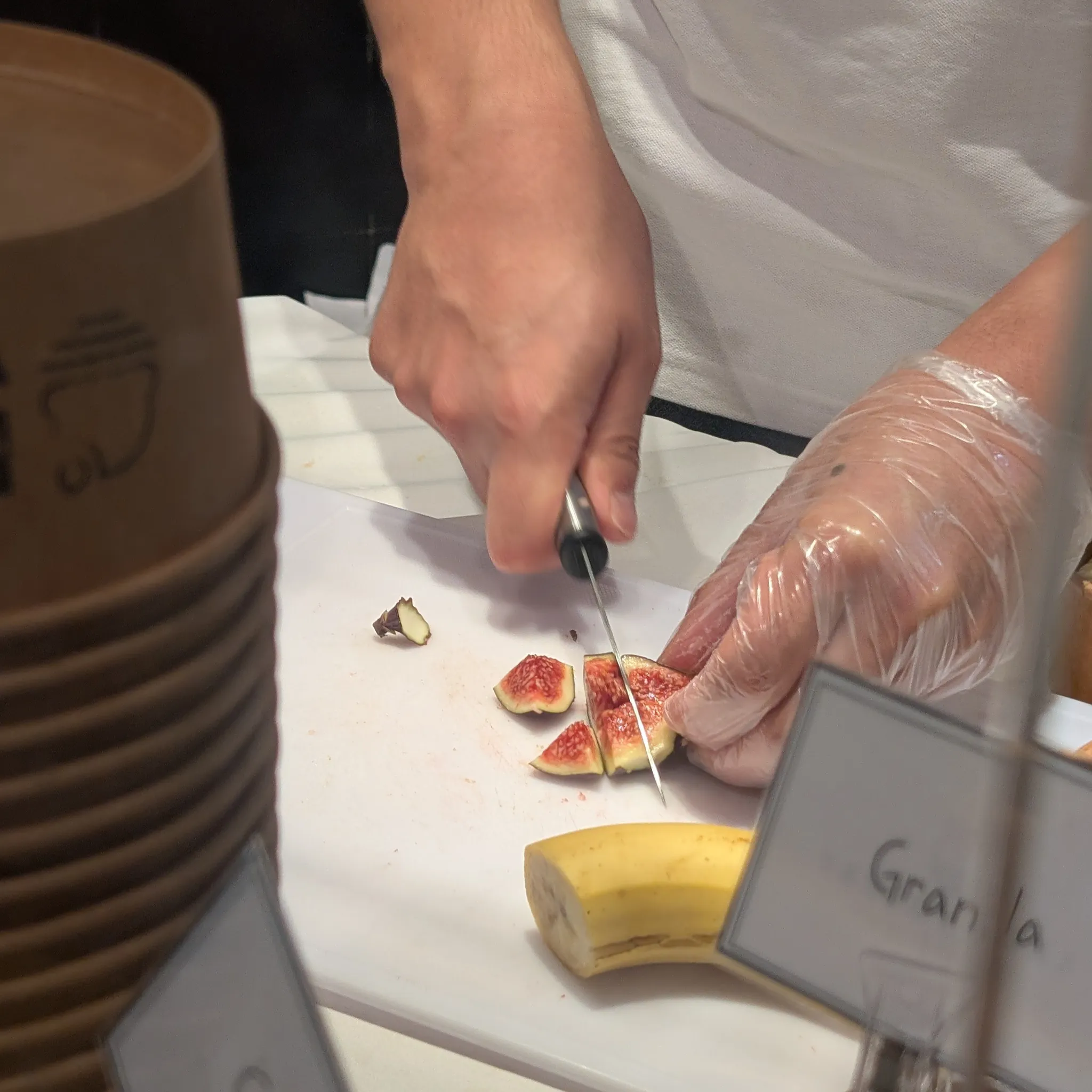 Staff preparing fresh fig toppings at the Lazy Yogurt pop-up