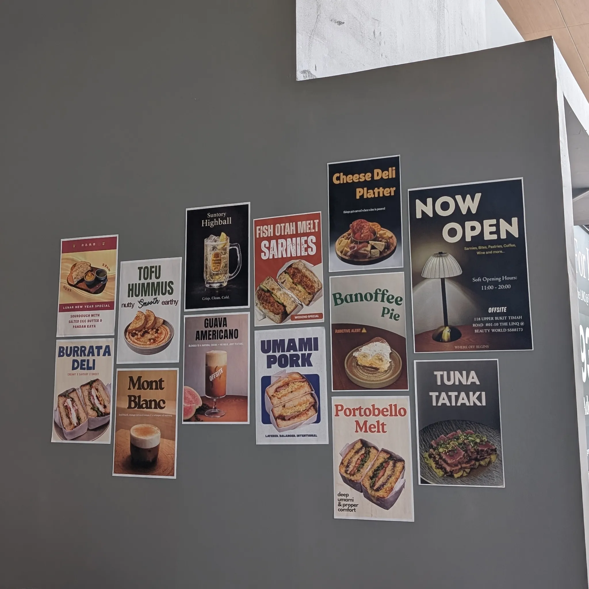 Promotional posters on the exterior of Offsite Cafe in Bukit Timah, Singapore