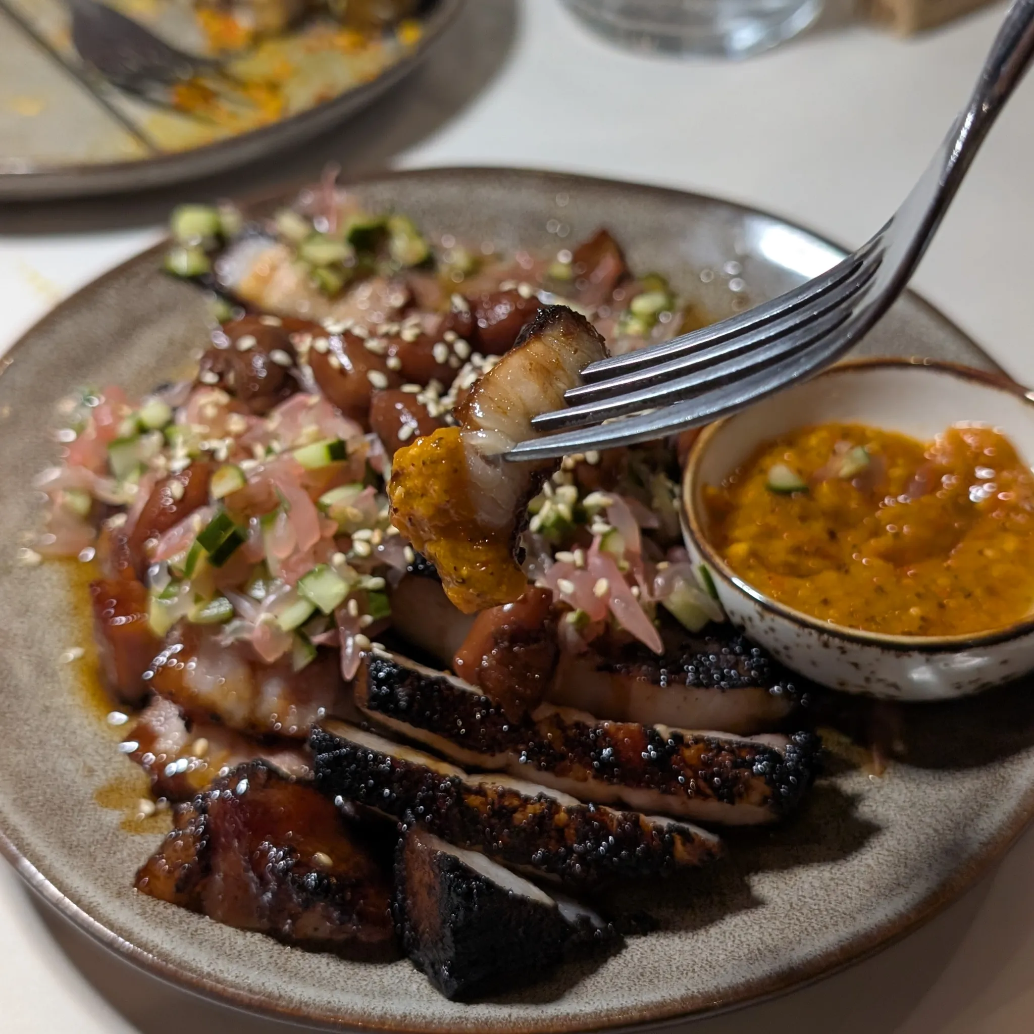 A close-up shot of Iberico Char Siew with Braised Peanut, Pink Pomelo Salsa, Fermented Tropical Hot Sauce from Psychotic Operator, Selangor, Malaysia